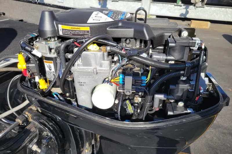 Slide: The Image of 2017 Lowe Fishing Machine 160S outboard motor, detailed view of engine components. - 14