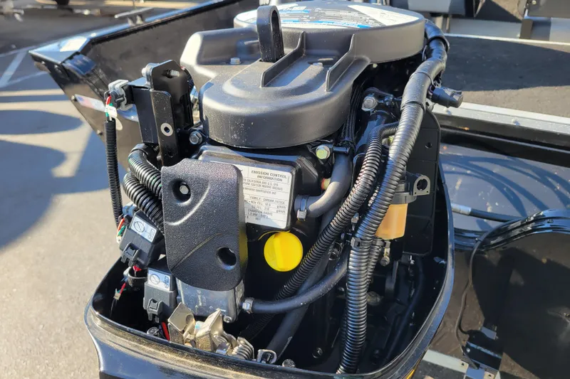 Slide: The Image of 2017 Lowe Fishing Machine 160S outboard motor, detailed view of engine components. - 15