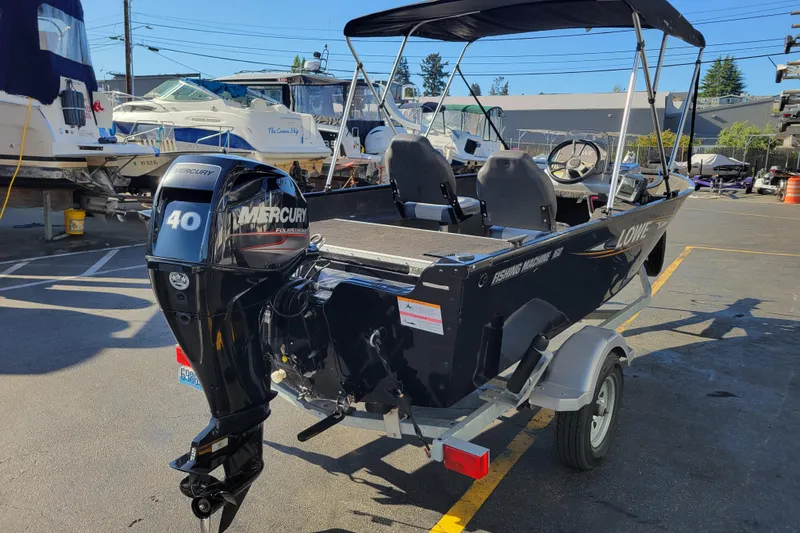 Slide: The Image of 2017 Lowe Fishing Machine 160S boat with Mercury 40 engine, parked in marina. - 4