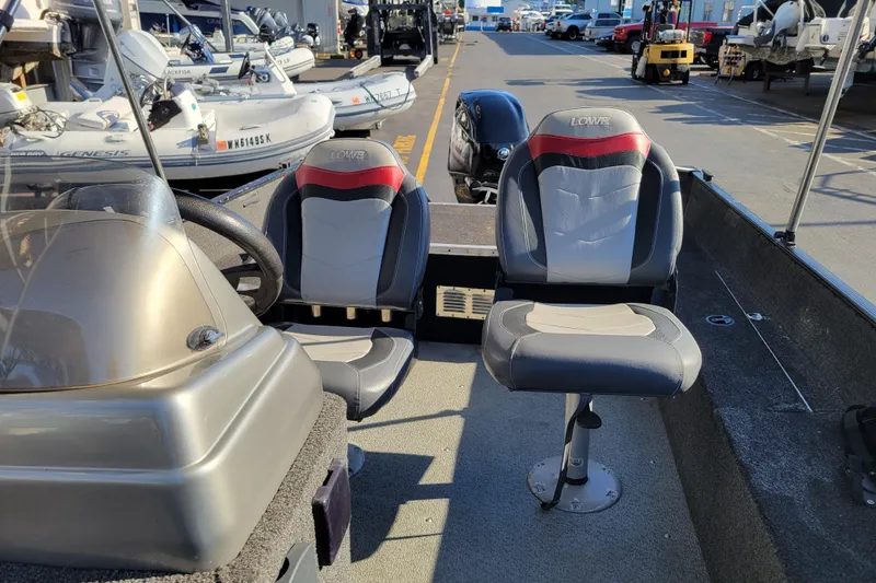Slide: The Image of 2017 Lowe Fishing Machine 160S interior with two seats and steering wheel. - 9