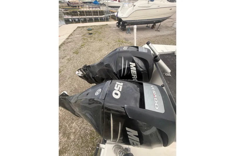 Slide: The Image of Twin Mercury Verado 150 engines on a 2012 Boston Whaler 255 Conquest boat. - 11