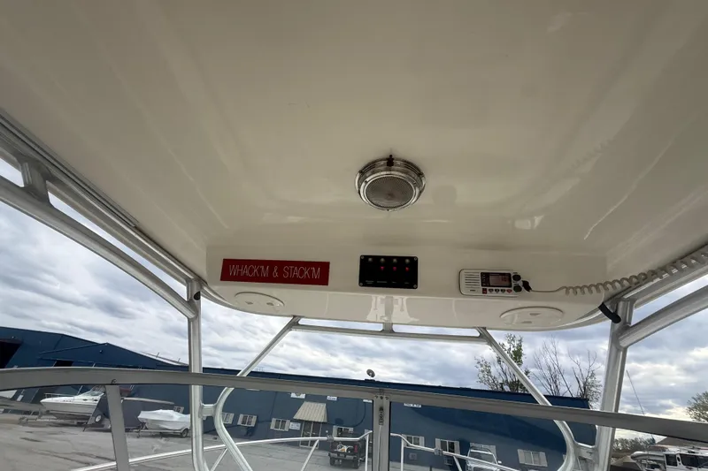 Slide: The Image of Interior view of a 2012 Boston Whaler 255 Conquest boat with control panel. - 13