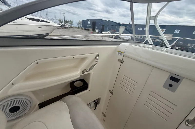 Slide: The Image of Interior view of a 2012 Boston Whaler 255 Conquest boat, showcasing seating and storage. - 16