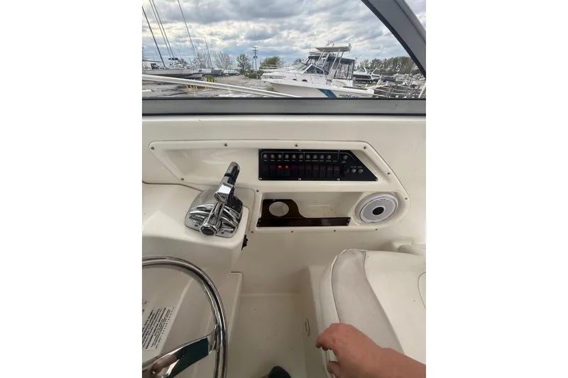 Slide: The Image of Interior view of 2012 Boston Whaler 255 Conquest boat cockpit controls and dashboard. - 21