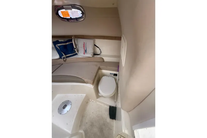 Slide: The Image of Interior cabin of 2012 Boston Whaler 255 Conquest with seating and marine toilet. - 25