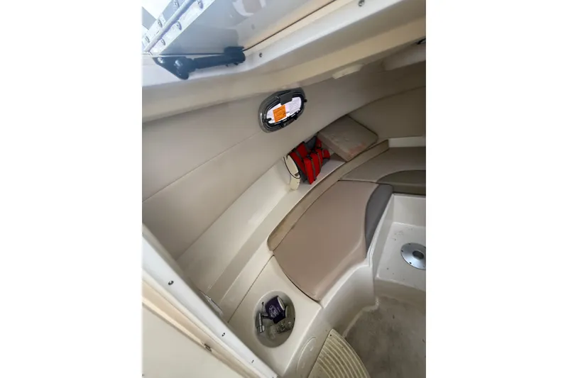 Slide: The Image of Interior cabin of 2012 Boston Whaler 255 Conquest, featuring seating and storage. - 29