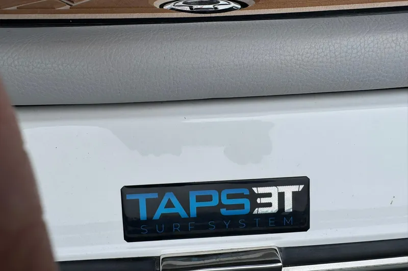 Slide: The Image of 2023 Tigé 25ZX boat featuring TAPS 3T surf system logo. - 11