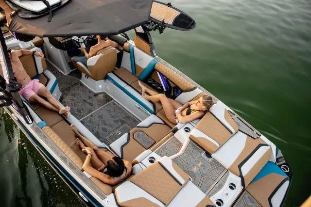 Slide: The Image of Manufacturer Provided Image: 2023 Tigé 25ZX boat with passengers relaxing on the deck in the water. - 16