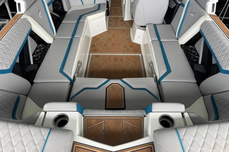Slide: The Image of 2023 Tigé 25ZX boat interior with luxurious seating and elegant wood flooring. - 19