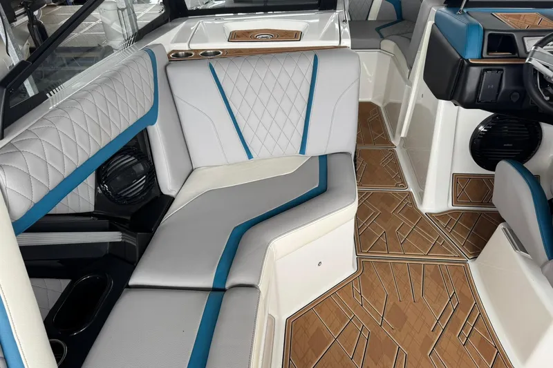 Slide: The Image of 2023 Tigé 25ZX boat interior with stylish seating and modern design. - 23