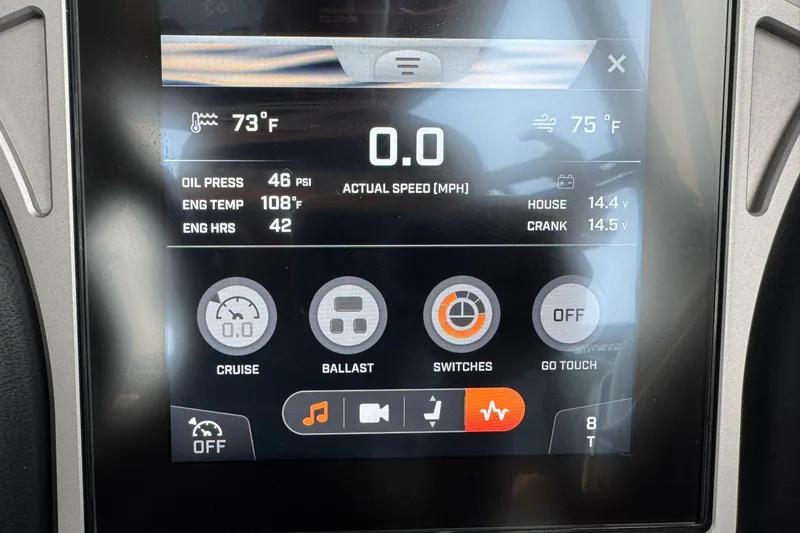 Slide: The Image of 2023 Tigé 25ZX dashboard display showing engine stats and control options. - 30