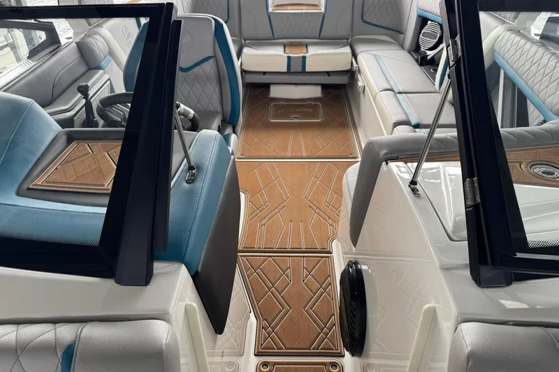 Slide: The Image of 2023 Tigé 25ZX boat interior with luxurious seating and stylish wood flooring. - 33