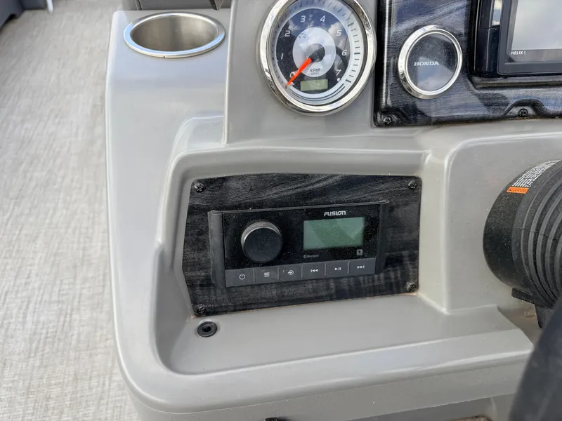 Slide: The Image of 2022 Tahoe Sport 2080 CRB boat console with Honda engine controls. - 21