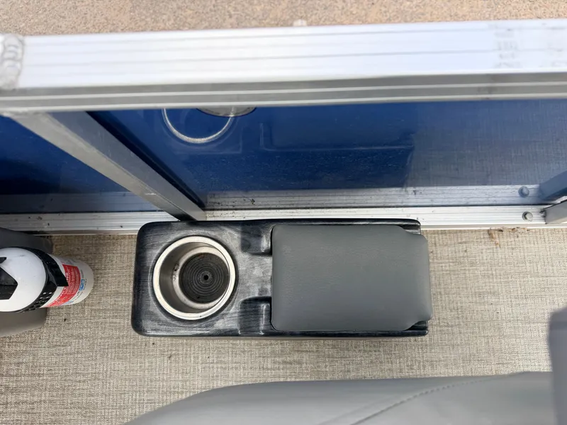 Slide: The Image of Interior of Tahoe Sport 2080 CRB with cup holder and fire extinguisher. - 23