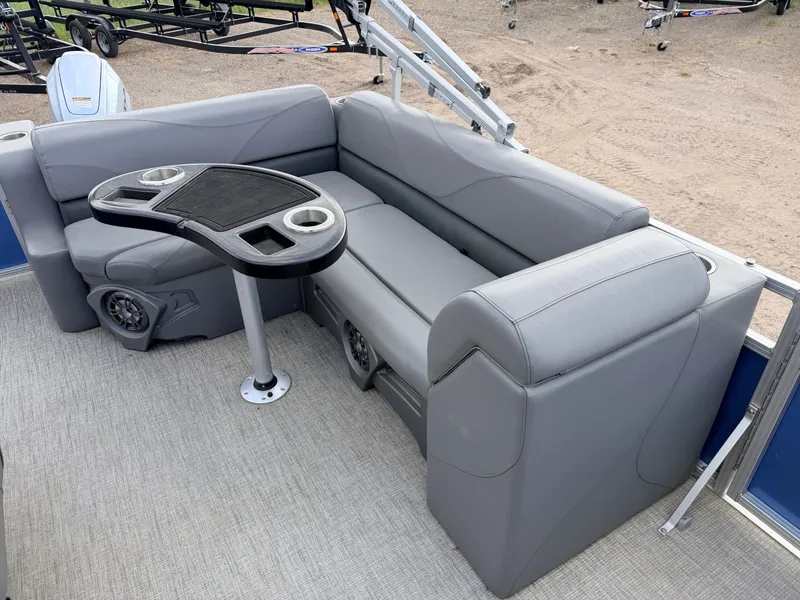 Slide: The Image of Interior of 2022 Tahoe Sport 2080 CRB with gray seating and table. - 25