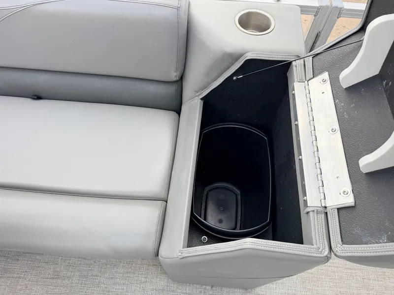 Slide: The Image of 2022 Tahoe Sport 2080 CRB seat with integrated storage and cup holder. - 26