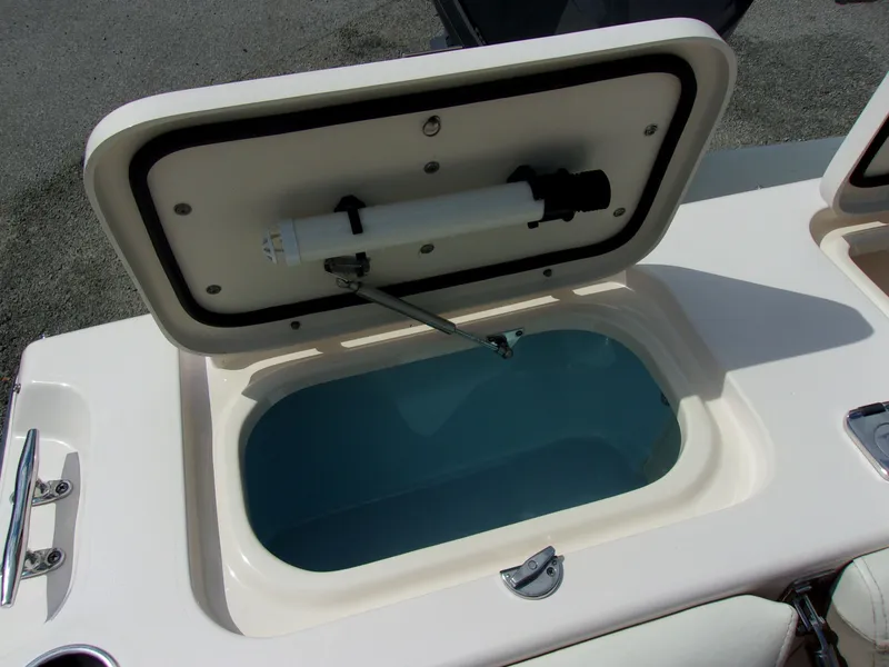 Slide: The Image of 2014 Grady-White Freedom 225, open storage compartment on boat. - 14