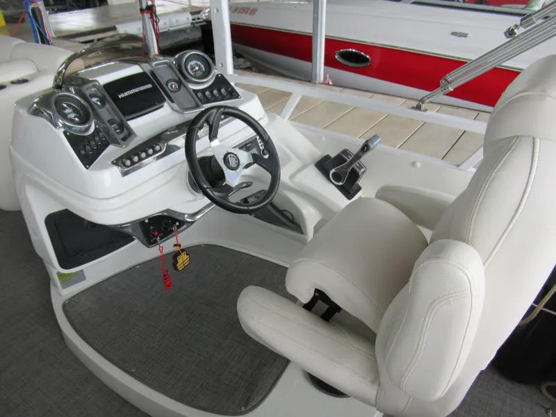 Slide: The Image of 2014 JC Sporttoon 26TT boat helm with steering wheel and instruments. - 10