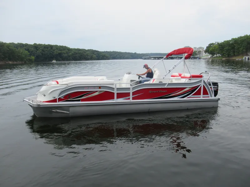 Slide: The Image of 2014 JC Sporttoon 26TT pontoon boat on calm lake. - 11