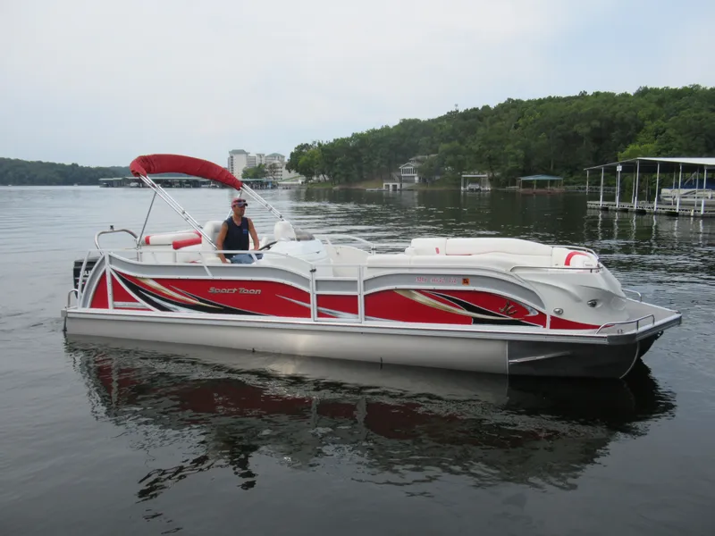 Slide: The Image of 2014 JC Sporttoon 26TT pontoon boat on a calm lake. - 3