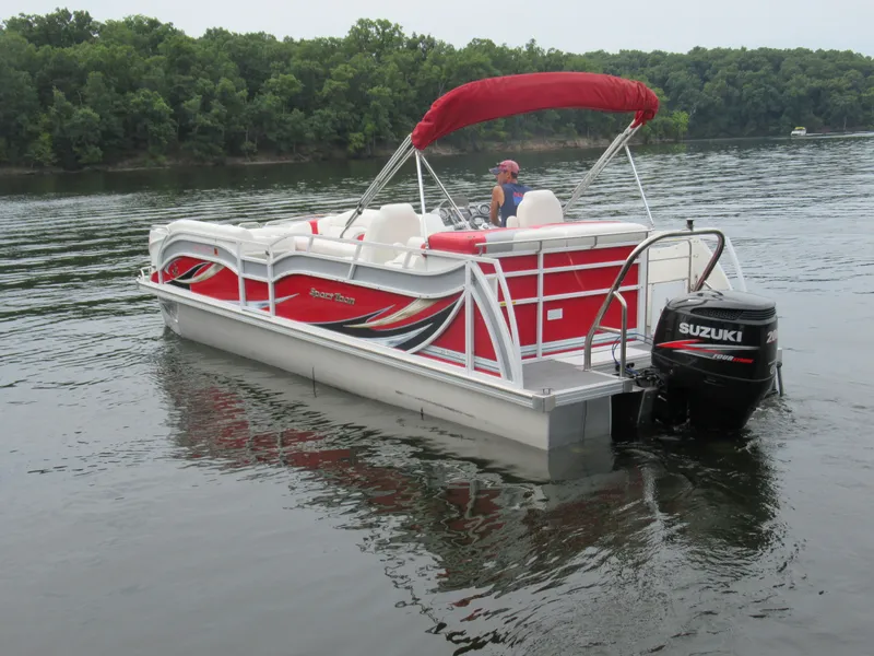 Slide: The Image of 2014 JC Sporttoon 26TT pontoon boat on a calm lake. - 4