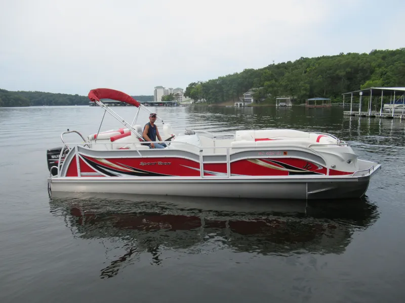 Slide: The Image of 2014 JC Sporttoon 26TT pontoon boat on a calm lake. - 5