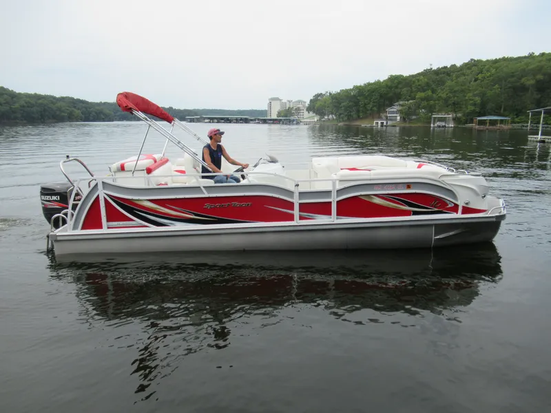 Slide: The Image of 2014 JC Sporttoon 26TT pontoon boat on a calm lake. - 7