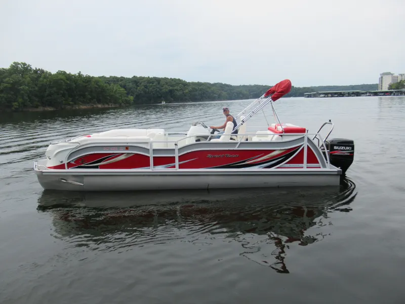 Slide: The Image of 2014 JC Sporttoon 26TT pontoon boat on a calm lake. - 9