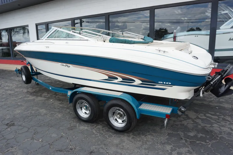 Slide: The Image of Interior view of a 1998 Sea Ray 210 Signature boat. - 12
