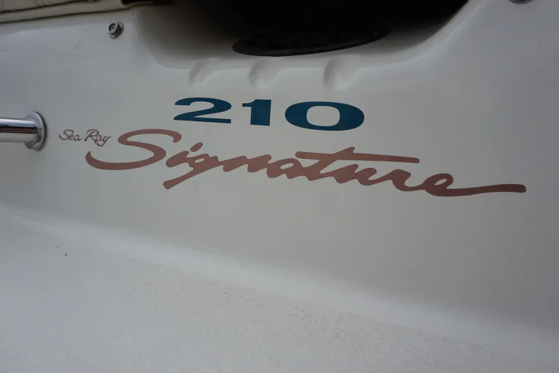Slide: The Image of 1998 Sea Ray 210 Signature boat on trailer, side view. - 6