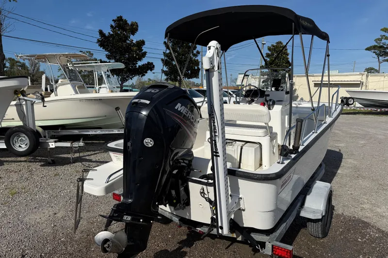 Slide: The Image of 2015 Boston Whaler 170 Montauk boat with Mercury engine on trailer. - 8