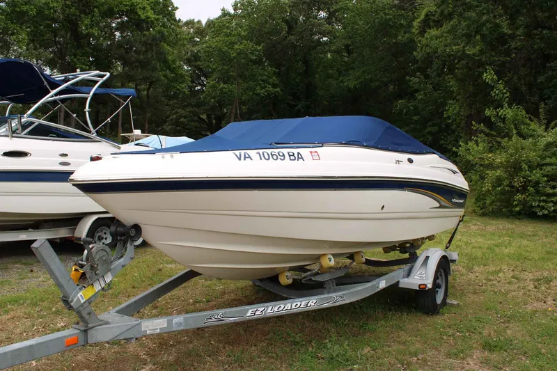 Slide: The Image of 2002 Chaparral Volvo Penta SX boat parked on trailer outdoors. - 2