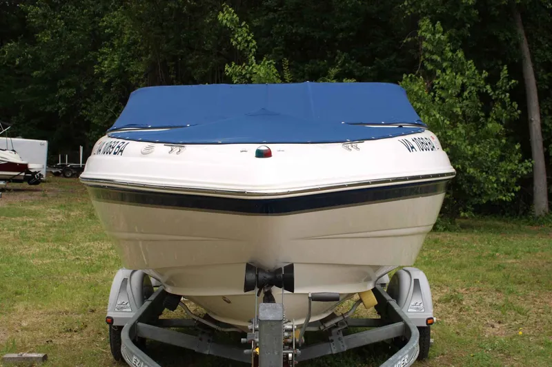 Slide: The Image of 2002 Chaparral Volvo Penta SX boat on trailer outdoors. - 3