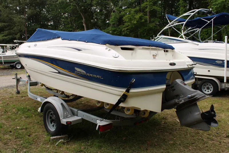 The Image of 2002 Chaparral Volvo Penta SX boat parked on trailer outdoors. - 1