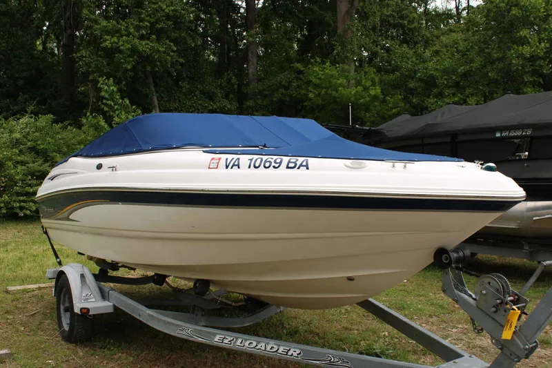 Slide: The Image of 2002 Chaparral Volvo Penta SX boat on trailer outdoors. - 4