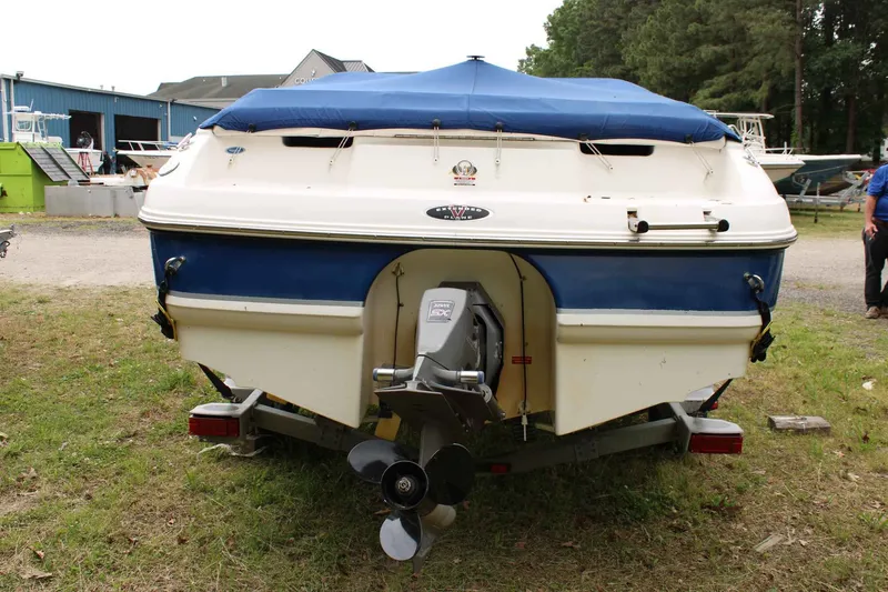 Slide: The Image of 2002 Chaparral Volvo Penta SX boat with blue cover. - 6