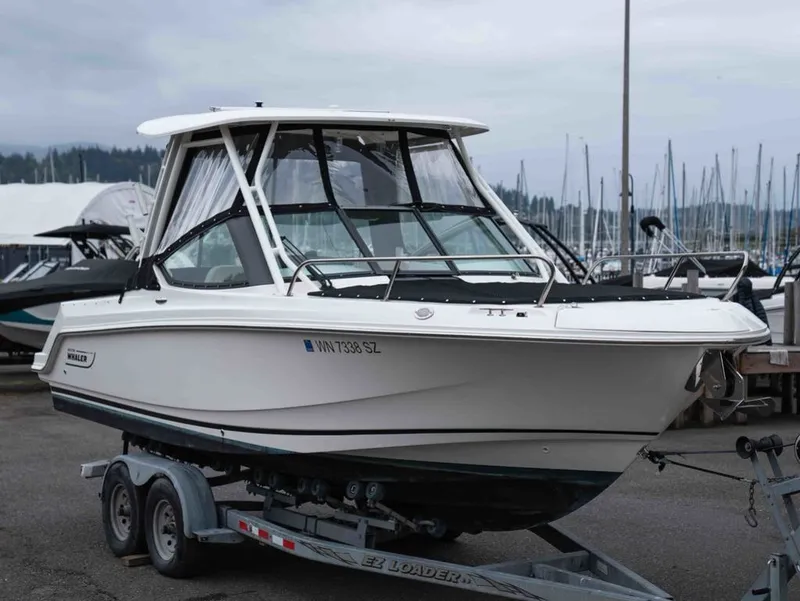 The Image of 2022 Boston Whaler 240 Vantage on trailer at marina. - 1