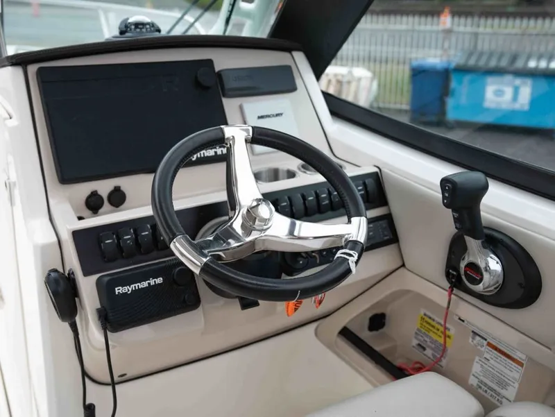 Slide: The Image of Boston Whaler 240 Vantage 2022 helm with Raymarine equipment. - 11