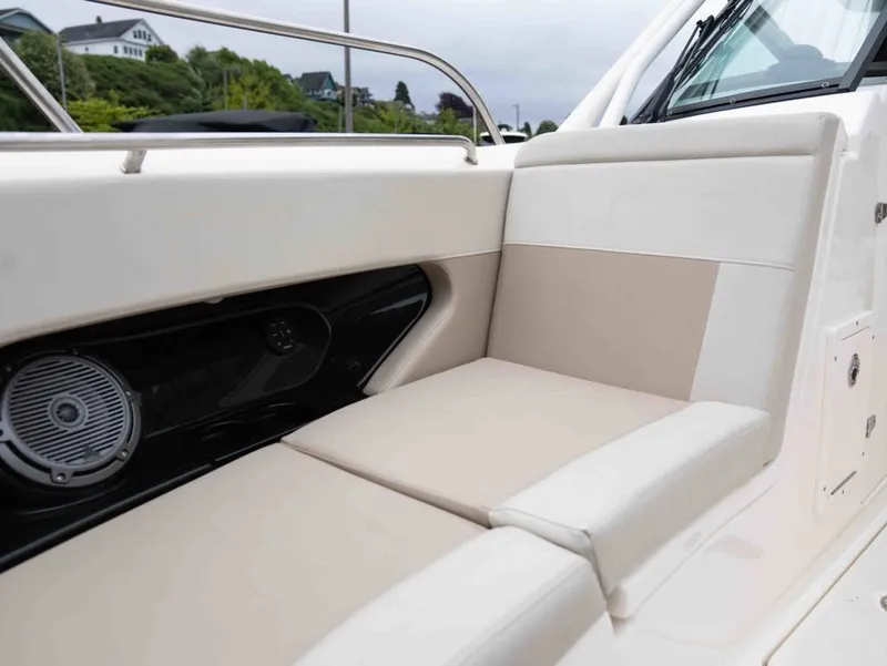 Slide: The Image of Interior of 2022 Boston Whaler 240 Vantage with beige seating area. - 15