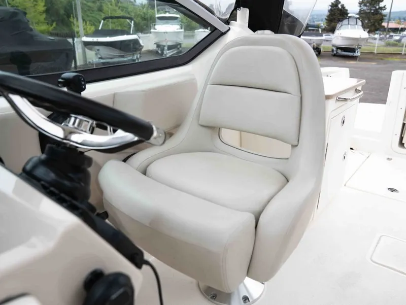 Slide: The Image of Interior of 2022 Boston Whaler 240 Vantage with beige seat. - 16