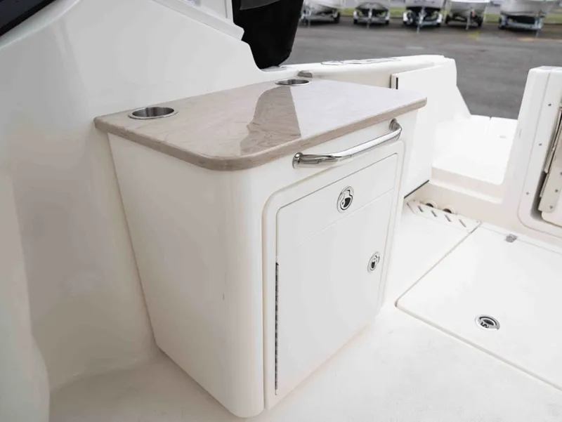 Slide: The Image of Interior of 2022 Boston Whaler 240 Vantage with storage compartment. - 18