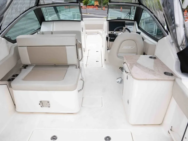 Slide: The Image of Interior of 2022 Boston Whaler 240 Vantage with seating and helm console. - 7