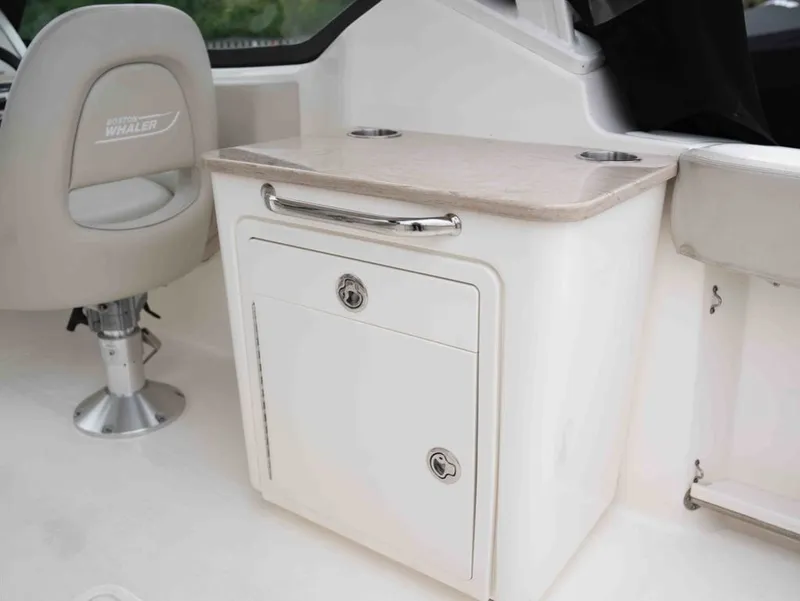 Slide: The Image of Interior of 2022 Boston Whaler 240 Vantage with seating and storage. - 9