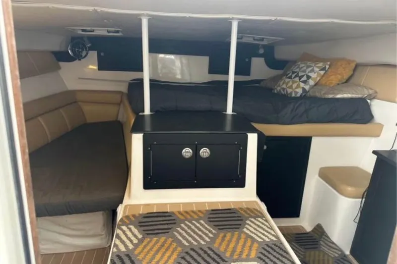 Slide: The Image of Interior cabin of 2008 ProKat 3660 Sport Fish with cozy seating and bedding. - 10