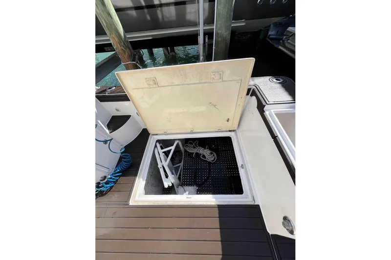 Slide: The Image of Open storage compartment on 2008 ProKat 3660 Sport Fish boat deck. - 12