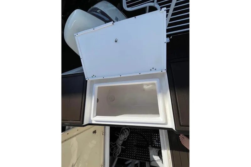 Slide: The Image of Open storage compartment on 2008 ProKat 3660 Sport Fish boat, showing interior space. - 14