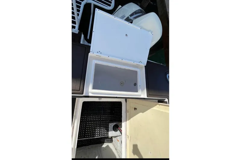 Slide: The Image of 2008 ProKat 3660 Sport Fish boat compartments and storage areas, open for inspection. - 15