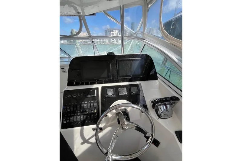 Slide: The Image of 2008 ProKat 3660 Sport Fish helm with steering wheel and control panel. - 5