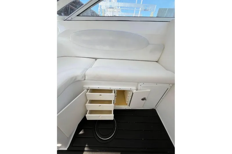 Slide: The Image of 2008 ProKat 3660 Sport Fish interior with white seating and storage drawers. - 7