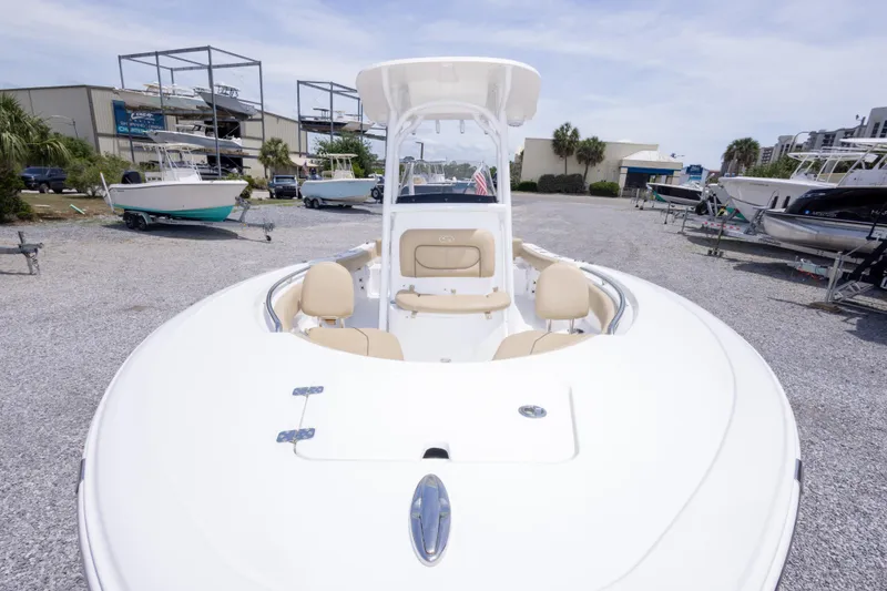 Slide: The Image of 2015 Sportsman Heritage 211 Center Console boat in a marina setting. - 16